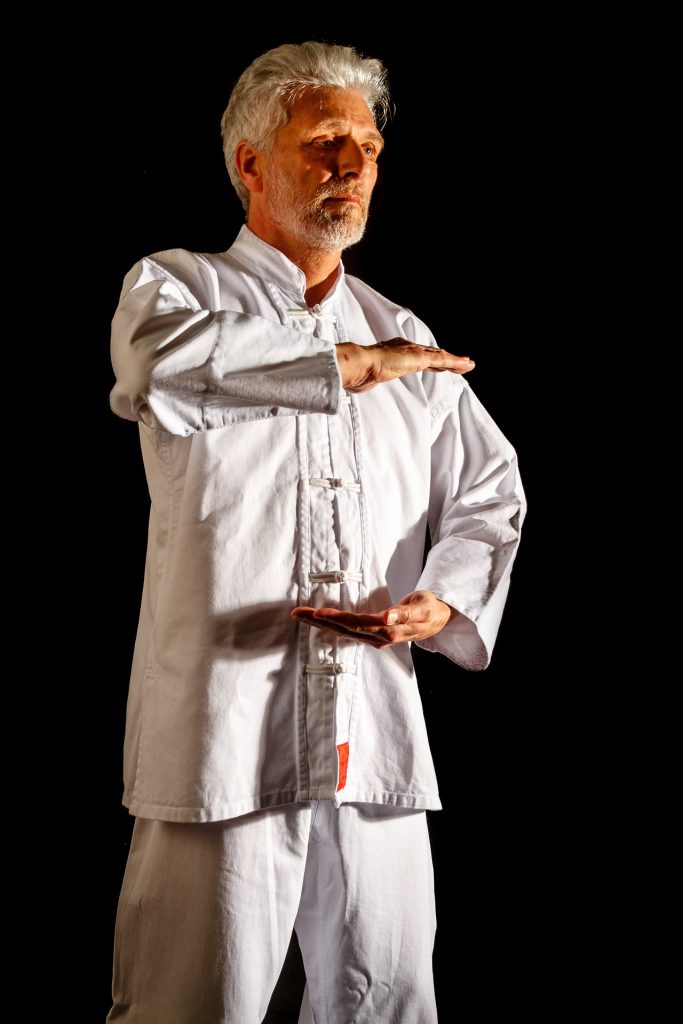 man exercising chi gong