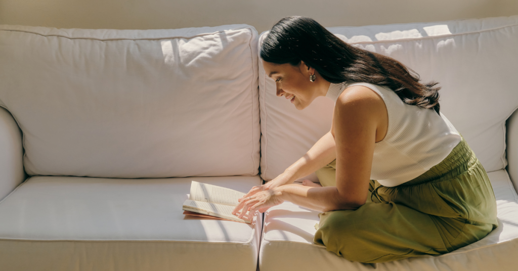 Woman reading a book on self care image